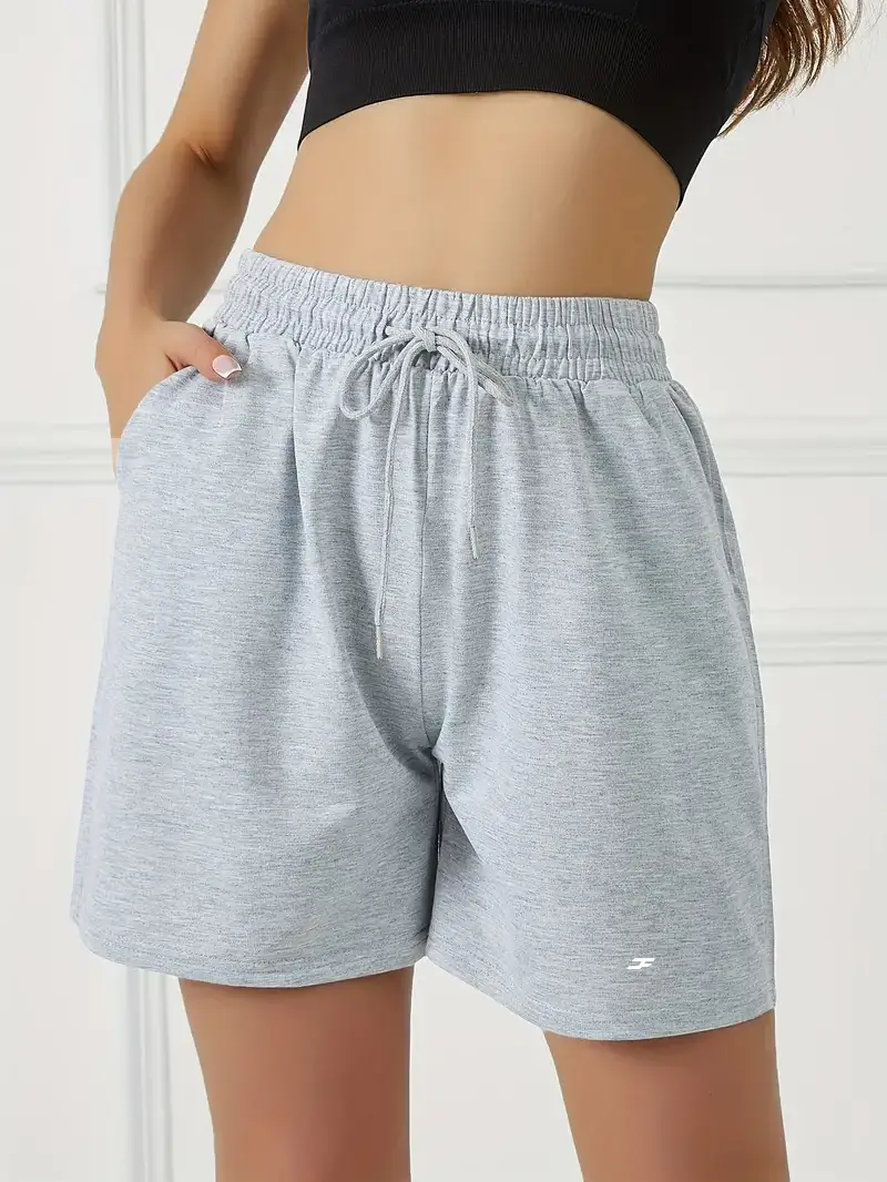 Women's casual drawstring waist shorts with front pockets for athletic running workout